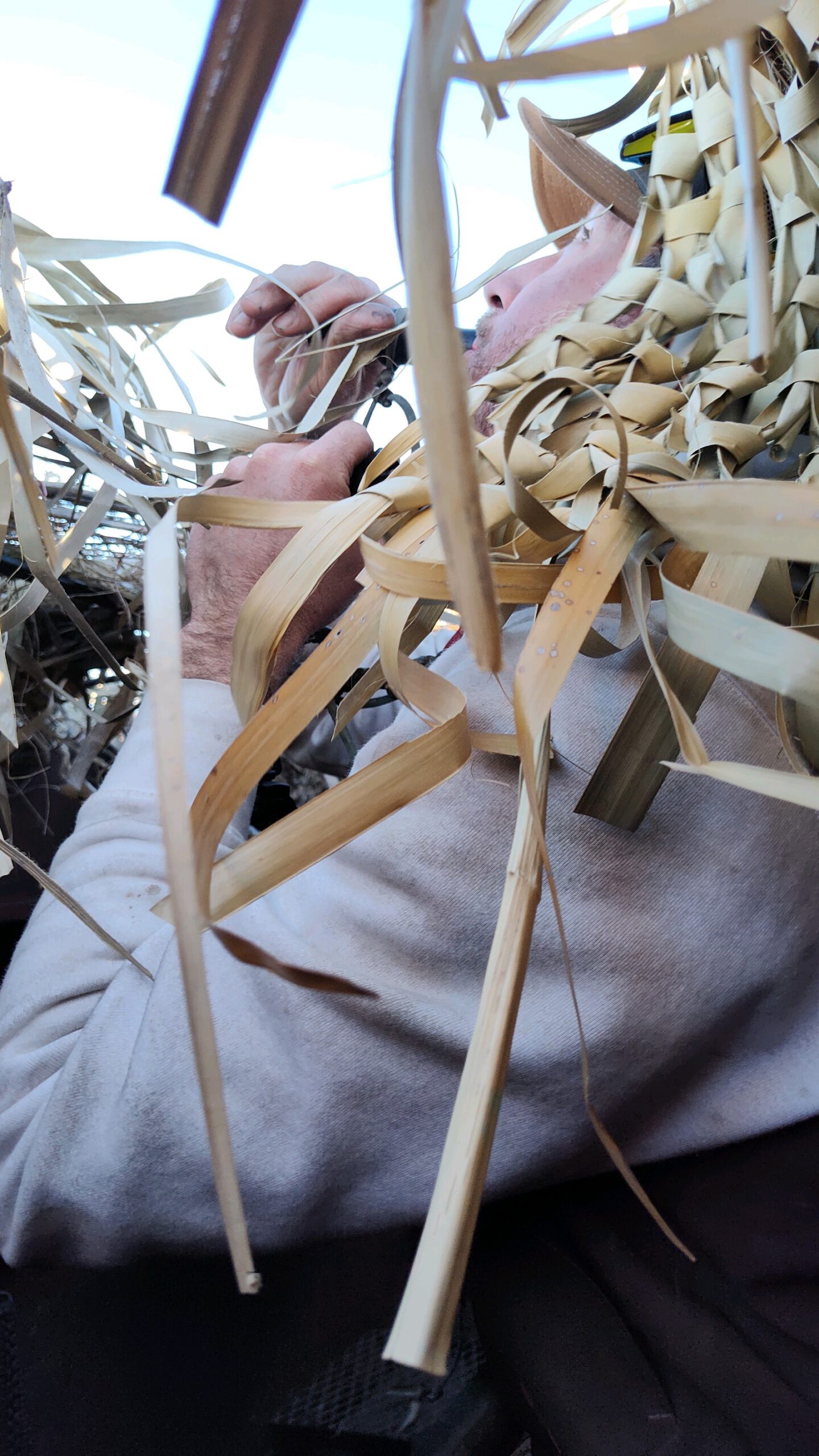 Hand tying decoy grass